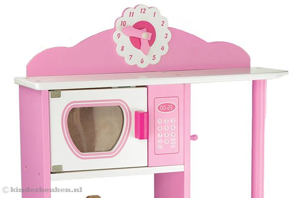 Magnetron en klok met draaibare wijzers.